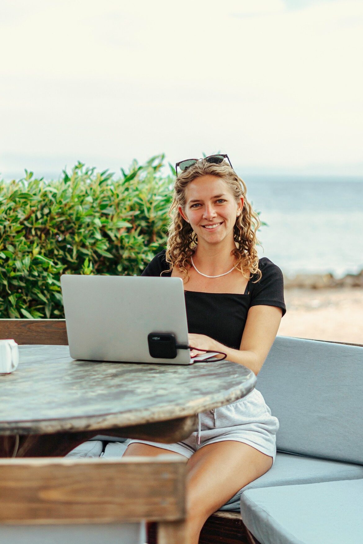 A laptop displaying a video call interface with a couple engaged in an online counseling session, representing the bridge technology provides in long-distance relationships.